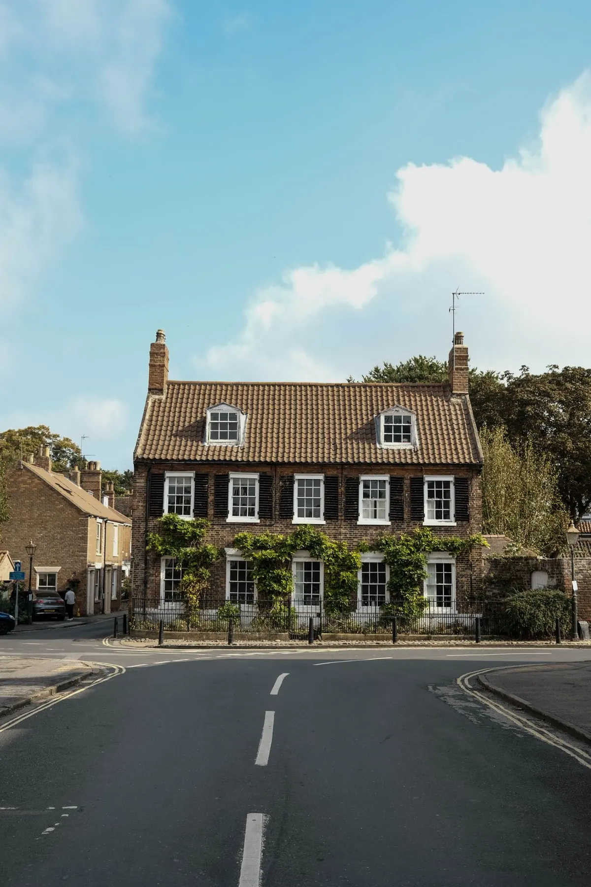 The front of a brick semi-detached house