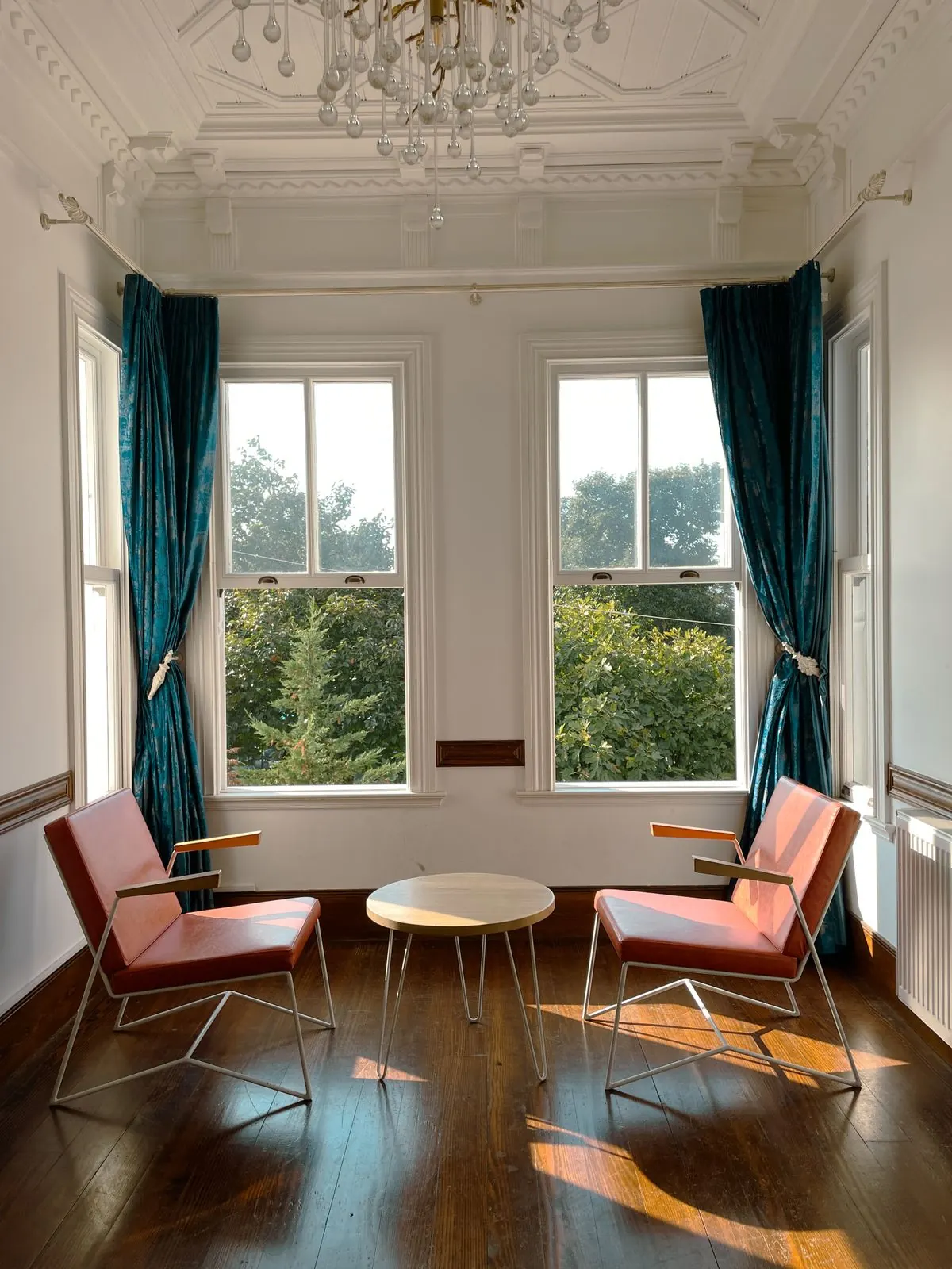 A bay window in a compact living room